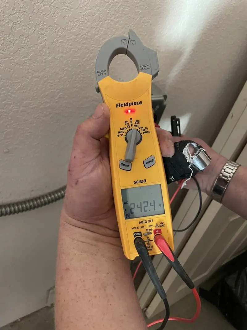 Voltage testing with clamp meter during Ceiling Fan Installation in East Cocalico